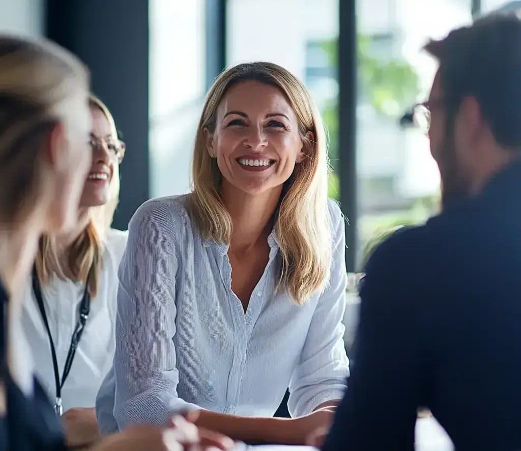 bizzywebai_group_of_coworkers_having_a_friendly_conversation_on_eb1d0fb5-f620-4413-bcb5-1b5d1da8b1fa 1-1
